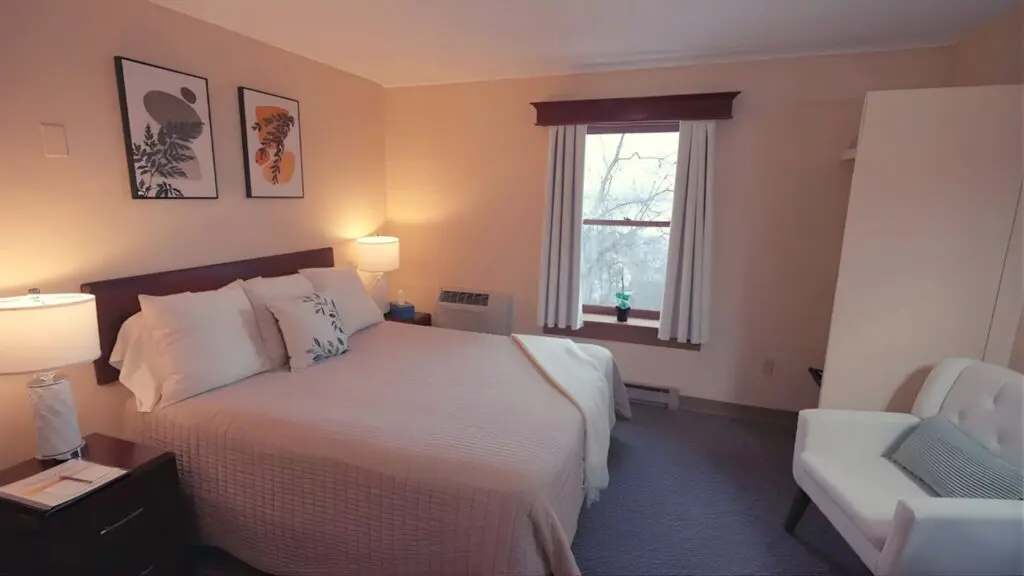 Comfortable, minimalist lodging at a spiritual retreat center designed for rest and inner renewal.