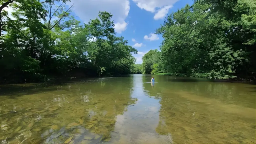 Flowing river near a spiritual retreat location, offering a serene setting for meditation and connection with nature.