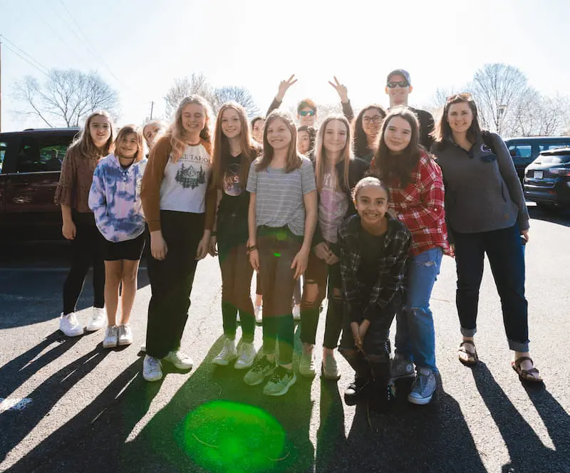 Group of girls posing together during a Christian youth retreat weekend